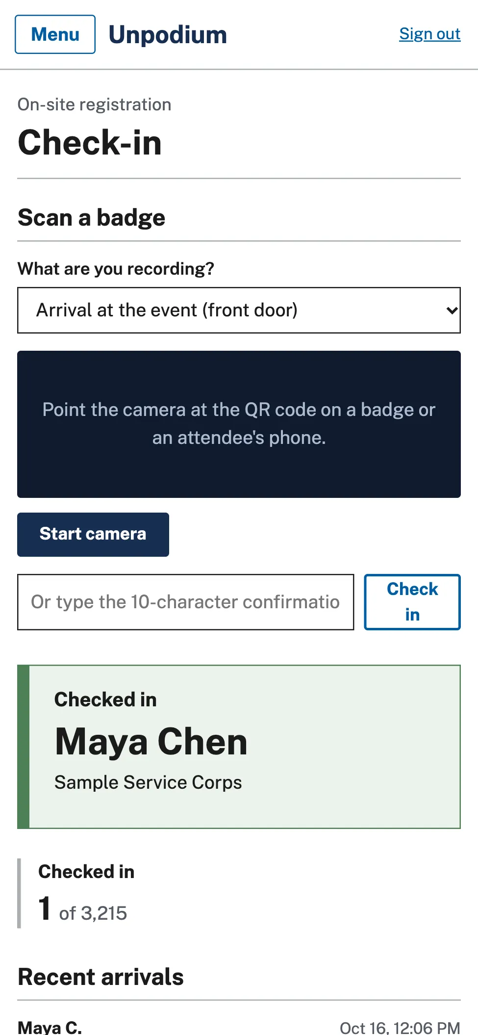 A phone showing the check-in screen after a badge scan, with the attendee's name and status.